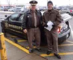 Sheriff  Raines & Special Deputy Lloyd Scharer "Fill A Cop Car" for local food banks.